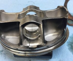 Dirt bike piston failed due to High stress combined with its lightweight design